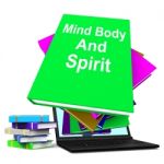 Mind Body And Spirit Book Stack Laptop Shows Holistic Books Stock Photo