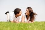 Young Couple Laying Down Stock Photo