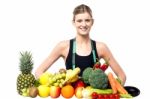 Slim Fit Girl With Fresh Fruits And Vegetables Stock Photo