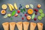 Flat Lay Various Fresh Fruits Setup On Dark Stone Background . S Stock Photo