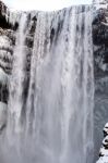 View Of Skogafoss Waterfall In Winter Stock Photo