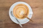 Coffee With Latte Art On Wooden Table Stock Photo