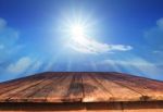 Old Wood Table And Sun Shine On Blue Sky Stock Photo