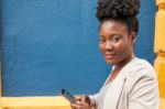 Young African Woman With A Smartphone Stock Photo