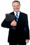 Happy Businessman Holding Files Stock Photo