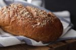 Dark Multigrain Bread Whole Grain Fresh Baked On Rustic Closeup Stock Photo