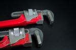 Red Pipe Wrench On Black  Background Stock Photo