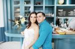 Portrait Of Happy Young Couple In Cafeteria Stock Photo