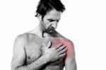 Young Man Having Chest Pain Stock Photo