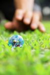 Hands And Earth Stock Photo