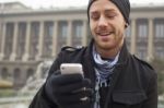 Man With Mobile Phone In Hands Stock Photo