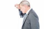 Worried Businessman Leaning Head On Wall Stock Photo