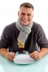 Smiling Man Holding Fork And Knife Stock Photo