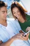 Young Couple Using A Digital Tablet Stock Photo