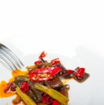 Fried Chili Pepper And Vegetable On A Wok Pan Stock Photo