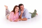 Couple Lying On The Floor Stock Photo