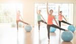 Asian Woman Doing Yoga Indoors Stock Photo