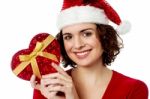 Christmas Shopping, Woman With Gift Stock Photo