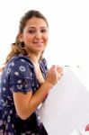 Side Pose Of Model Holding Carry Bags Stock Photo