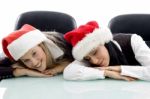 Young Colleagues Wearing Christmas Hat Stock Photo