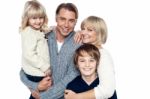 A Happy Family With Children In Studio Stock Photo