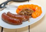 Beef Sausages Cooked On Iron Skillet Stock Photo