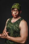 Creative And Funny Military Style Camouflage On Tankman Face Stock Photo