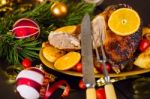 Christmas Baked Duck Served With Potatoes, Orange And Tomatoes Stock Photo