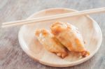 Grilled Chicken Wings On Wooden Plate Stock Photo