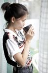 Young Woman And Coffee Cup In Hand Stock Photo