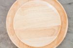 Wooden Plate On Grey Background Stock Photo