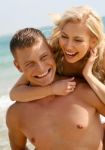 Young Couple At Beach Stock Photo