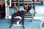 Athletic Guy Doing Barbell Bench Press Stock Photo