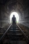 Man In A Tunnel Looking Towards The Light Stock Photo