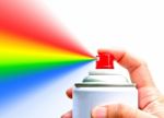 Hand Holding Spray With Rainbow Stock Photo