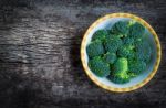 Top View. Fresh Green Broccoli On Plate Over Wooden Background Stock Photo