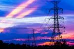 Electricity Pillars Against Colorful Sunset Stock Photo