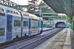 Running Train At Station Stock Photo