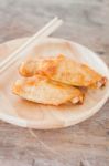 Grilled Chicken Wings On Wooden Plate Stock Photo