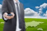 Businessman Holding Mobile Phone Stock Photo