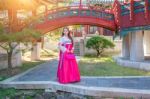 Woman With Hanbok In Gyeongbokgung,the Traditional Korean Dress Stock Photo