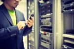 Man Fix Server Network In Data Center Room Stock Photo