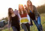 Portrait Of Group Of Friends Having Fun In Field Stock Photo