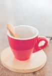 Red Mug With Wooden Plate Stock Photo