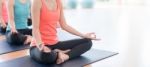 Asian Woman Doing Yoga Indoors Stock Photo