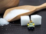 Miniature Fat Woman Standing Near Wooden Bowl And Spoon With Sug Stock Photo