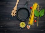 The Thin Spaghetti On Black Wooden Background. Yellow Italian Pa Stock Photo