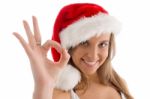 Model With Christmas Hat And Showing Ok Sign Stock Photo