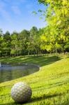 Park With Basin On Sunset And Statue Golf Ball Stock Photo