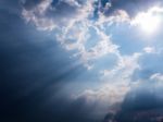 Beam Of Sunlight Behind Dark Clouds Stock Photo